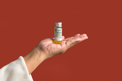 CBD Bath Oil in hand